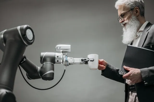 Robot and a Person with Cup